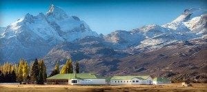 Estancia Cristina lodge surrounded by snow-capped mountains and lush greenery in Argentina, highlighting the scenic beauty of this travel destination.