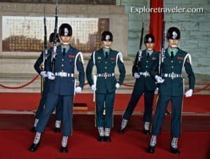 Changing of the Guards ceremony at Chiang Kai-shek Memorial Hall, Taipei, featuring soldiers in ceremonial uniforms holding rifles.