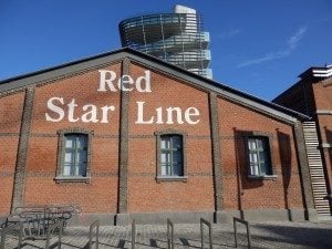 Brussels South Railway Station exterior with "Red Star Line" text on brick wall, showcasing travel hub significance in Brussels.