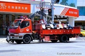 Tow away truck for illegally parked scooters in Hsinchu Taiwan Ouch