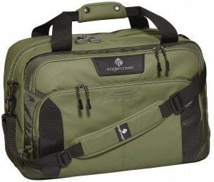 Green travel briefcase with multiple compartments and adjustable shoulder strap, ideal for travelers seeking practical luggage solutions.