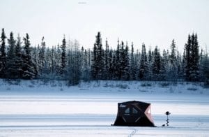 Ice fishing in comfort on Chena Lake in Alaska - A person that is standing in the snow - Alaska