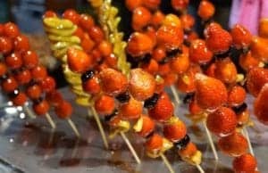 Candied strawberries, tomatoes, mangoes and plums. A favorite in Taiwan! - Food on a plate - Candied fruit