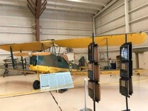 A large yellow machine in a room - Aviation