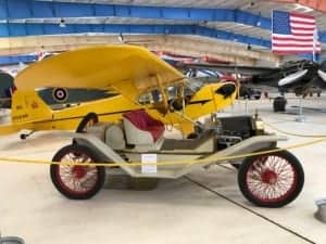 A small airplane is parked on the side of a building - Car