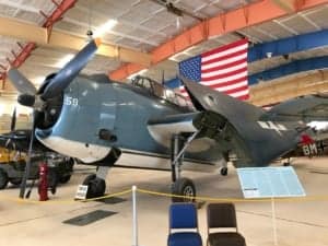 A fighter jet sitting on top of a table - Grumman F6F Hellcat