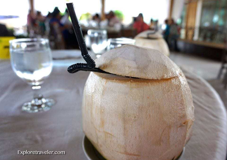 Buko Juice: Paborito Ng Mga Pilipino - A glass of wine sitting on top of a table - Philippines