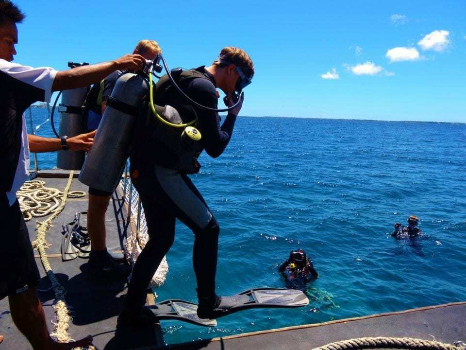 Scuba Diving In The Waters Of The Philippine Sea - A group of people standing next to a body of water - Philippines