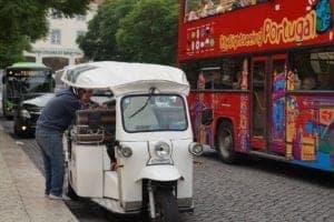 ExploreTraveler Presents: Exploring Lisbon Portugal Part 1 - A bus that is parked on the side of the street - Rickshaw