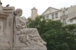 ExploreTraveler Presents: Exploring Lisbon Portugal Part 1 - A statue in front of a building - Statue