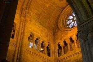Exploring Sé de Lisboa Cathedral In Lisbon Portugal - A clock on the side of a building - Lisbon Cathedral