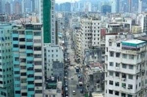 Aerial view of densely packed buildings in Hong Kong, showcasing the urban landscape surrounding the Goldfish Market.