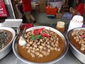 The Adventure Of Eating Our Way Around Taiwan - A bowl of food on a table - Vegetarian cuisine