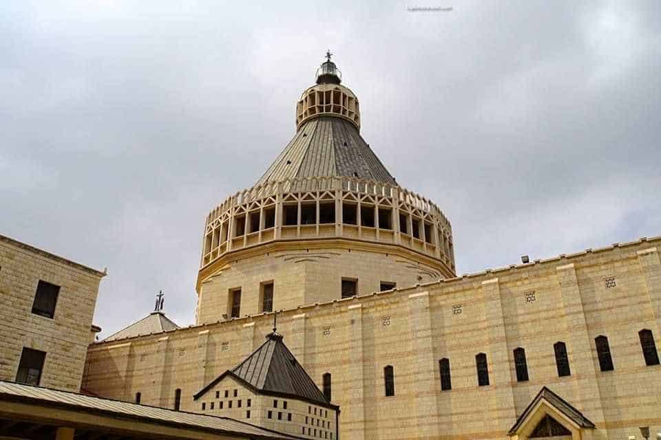 The Church Of The Annunciation In Nazareth, Israel - A large clock tower in front of a building - Basilica of the Annunciation