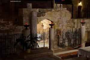 The Church Of The Annunciation In Nazareth, Israel - A close up of a stone building that has a sign on a wall - Basilica of the Annunciation