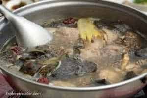 Eat Like A King And Travel The World - A bowl of food cooking on a stove - Hot pot