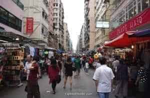 Scenes Of Hong Kong In It’s Everyday Splendor - A group of people walking on a city street - Mong Kok Flower Market