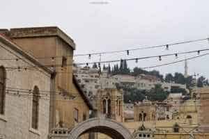 Historic buildings and rooftops of Nazareth, Israel, with Mount Precipice in the background, showcasing the area's religious significance and cultural heritage.