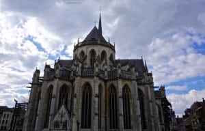 Elegant church architecture with intricate details and spires under a cloudy sky, highlighting global architectural styles featured in ExploreTraveler's travel insights.