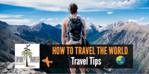 Person standing on a mountain overlooking a vast landscape, featuring the ExploreTraveler logo and text "HOW TO TRAVEL THE WORLD" with icons representing travel tips and safety.