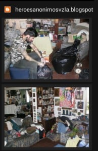 Man packing items into a black trash bag in a cluttered living room with various decorations and furniture, illustrating a process of organizing or cleaning.