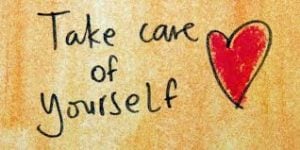 Handwritten message "Take care of yourself" with a red heart, emphasizing self-care for travelers in Iceland.