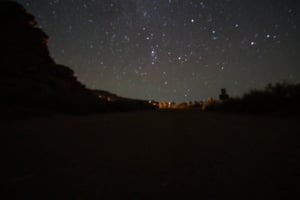 Night view of Chaco Culture National Historical Park campground under a starry sky, showcasing the serene atmosphere and natural beauty of the area.