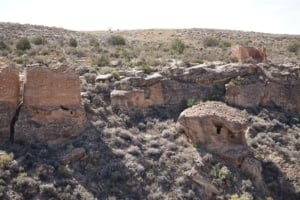 Eroded Boulder House ruins in Hovenweep National Monument, showcasing ancient Puebloan architecture amidst a rugged landscape.