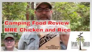 Man holding MRE package labeled "Chicken and Rice" in a forest setting, featuring text overlay "Camping Food Review," relevant to camping food tips and outdoor experiences.
