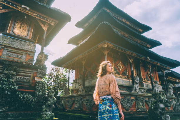 Girl walking in front of temple