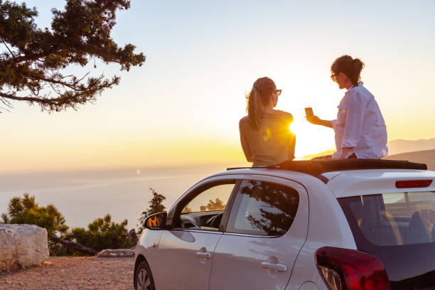 women enjoying a summer’s road trip.