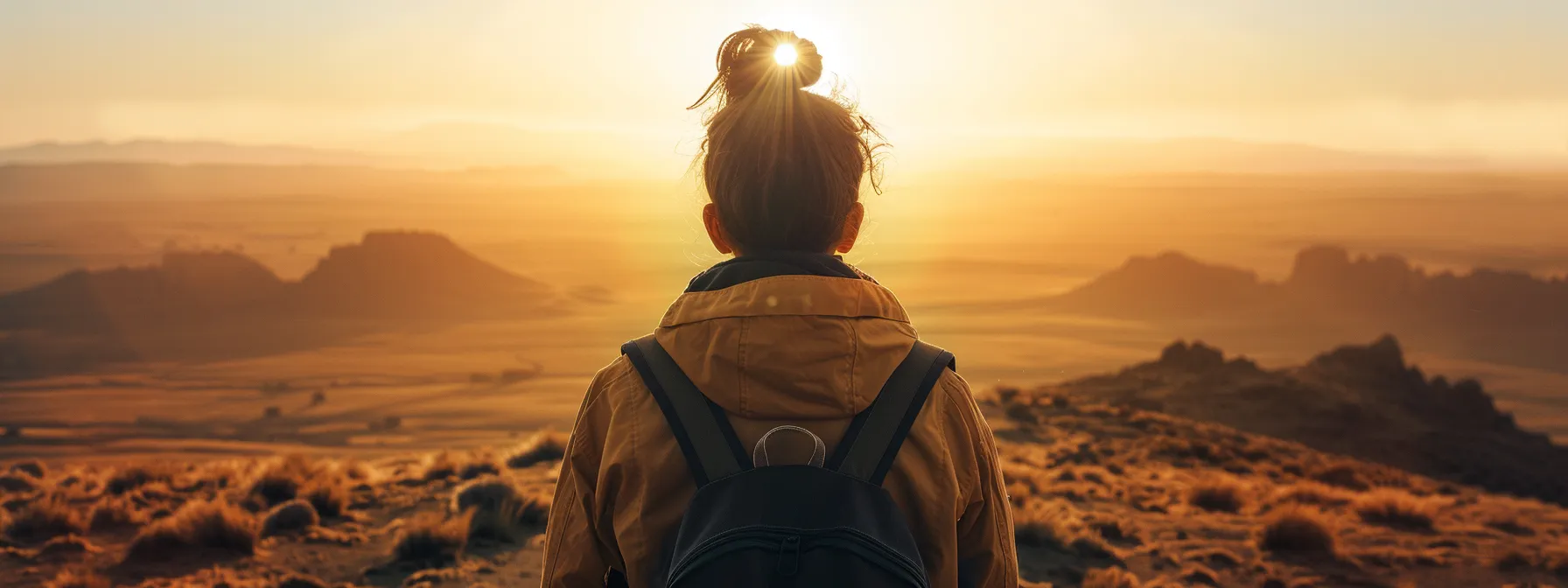 embracing uncertainty in a nomadic lifestyle, a person confidently gazes towards a distant horizon, ready to conquer new challenges and foster personal growth.