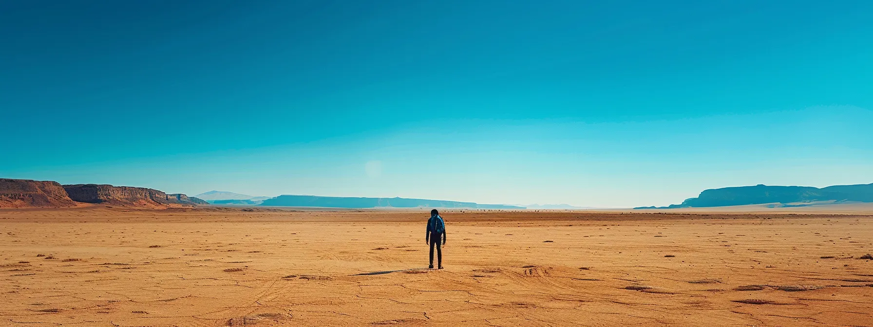 a lone traveler standing in a barren desert landscape with only a small backpack, symbolizing a minimalist lifestyle focused on experiences over possessions.